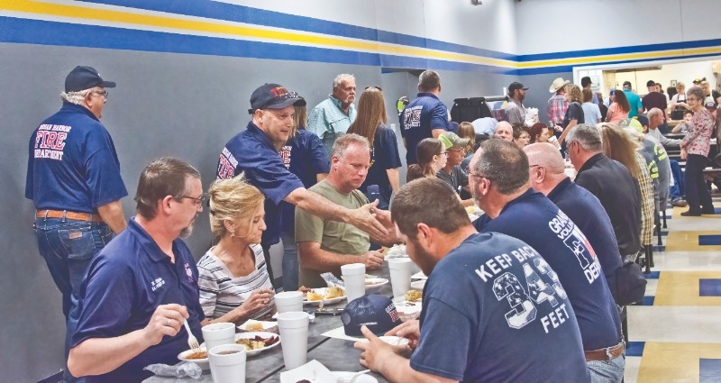 TEAM BBQ: The entire Lipan High School barbecue team lined up to serve to a packed cafeteria of hungry volunteer fire department staff and other first responders from the Hood County area.