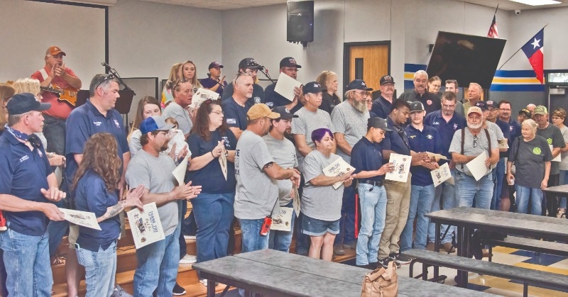 A ROUND OF APPLAUSE: The first responders who helped fight the Big L fire were recognized for their service with certificates, delicious barbecue and a well-deserved ovation.